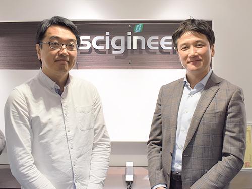 吉井伸一郎ＣＥＯ（写真右）と情報システム部プロダクトソリューショングループ・土居清晃マネージャー